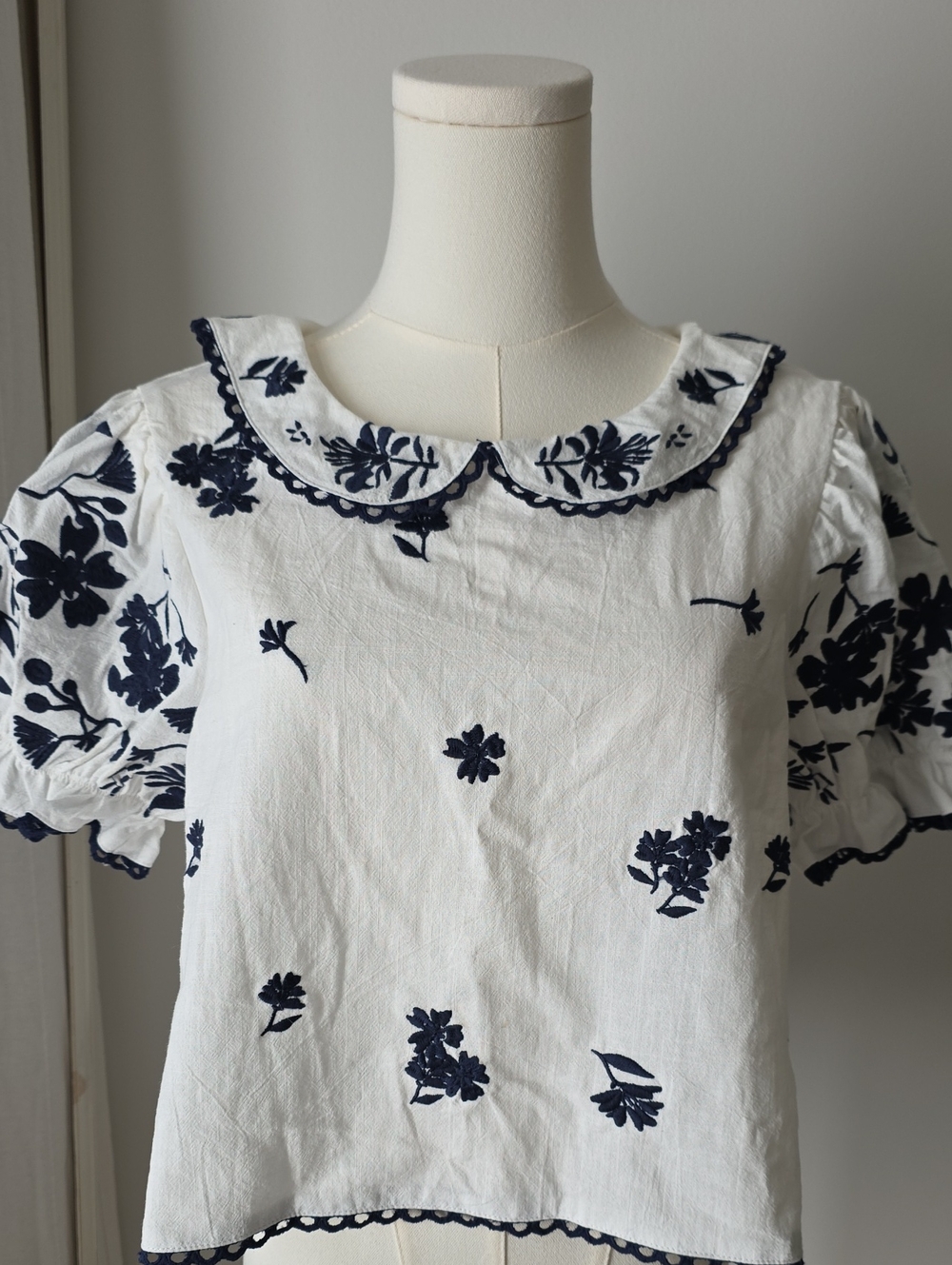 White Blouse with Navy Floral Embroidery and Peter Pan Collar